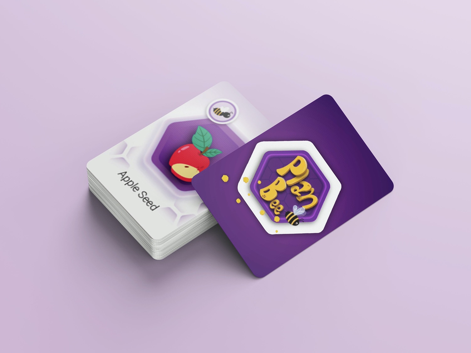 Plan Bee card deck, showing an illustrated Apple Seed card and the hexagonal bee logo on the card back.